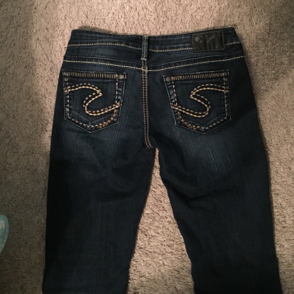 Silver jeans.
