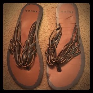 Brown leather flip flops