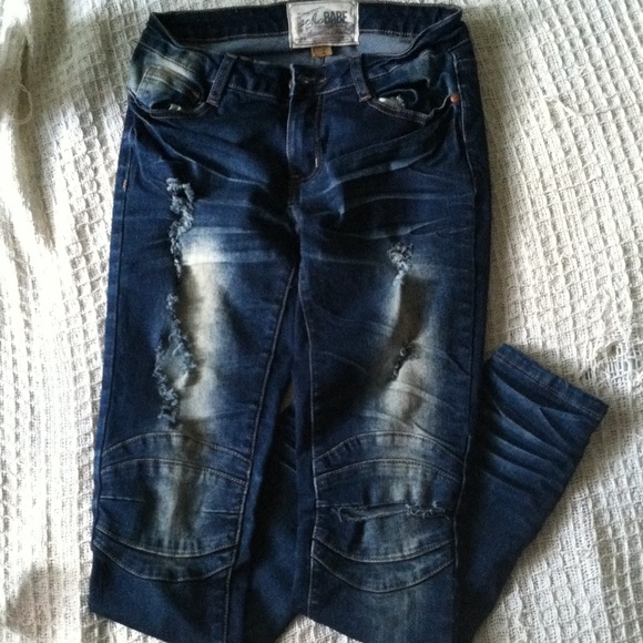 Female distressed knee biker jeans