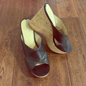 Black leather wedge sandals with a cork heel