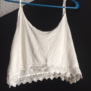 Sheer white crop top with lace trim
