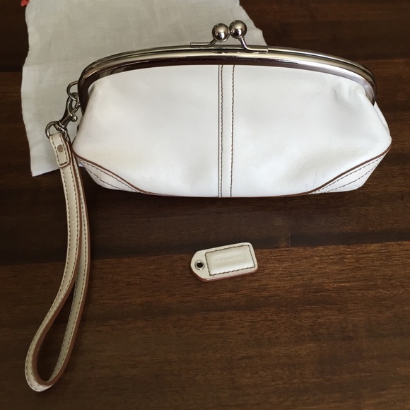 Coach Handbags - Coach cream w brown stitching wristlet