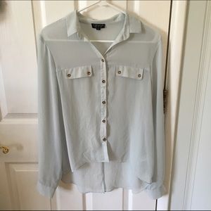 Light blue button up blouse.