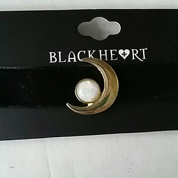 Black velvet choker with a gold Cresent moon