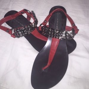 Red leather sandals with silver discs