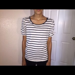 White top with blue stripes