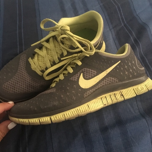 Grey and neon yellow/green Nike free runs