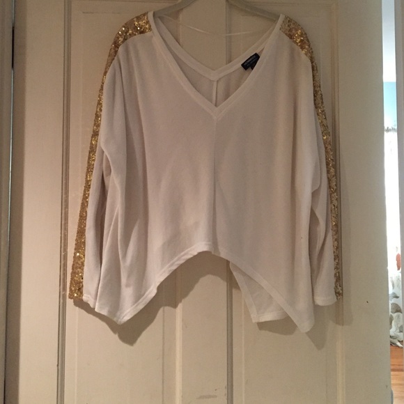 White sweater with gold sequin sleeves