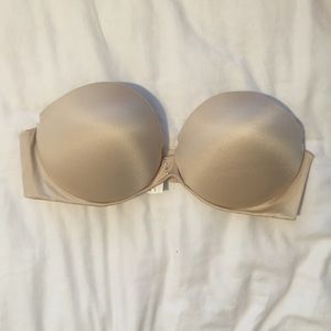 Beige strapless bra with gold detailing in front