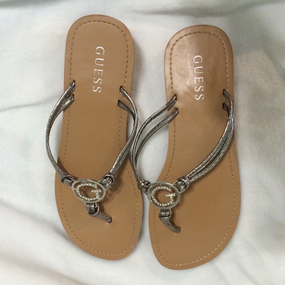 Guess flip flops. Silver and tan. Never worn