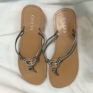 Guess flip flops. Silver and tan. Never worn
