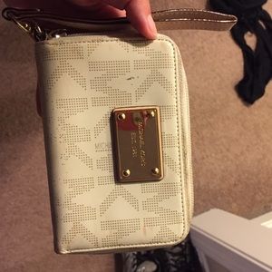 Cream colored Michael Kors wristlet