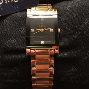Yellow Gold Bulova watch with diamond chips