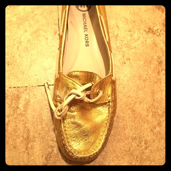 Michael Kors gold boat shoes