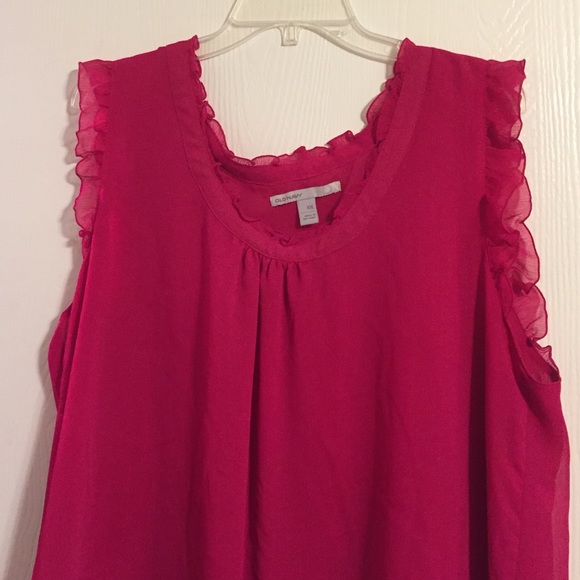 PLUS:  Pink ruffled sleeveless blouse