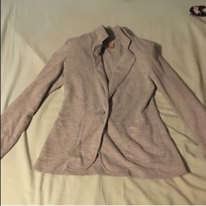 Blazer and foundation stick and rock nudes