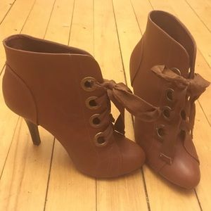Brown high heeled lace up booties