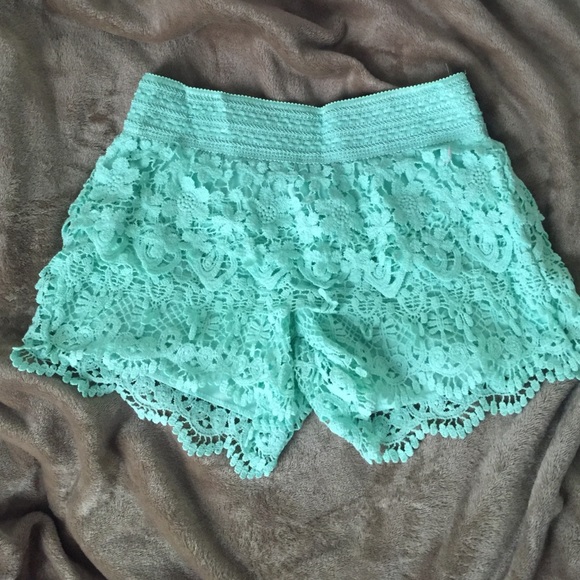 Greenish blue crocheted shorts.