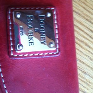 Wallet by Dooney and bourke leather .