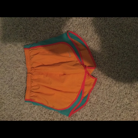 Orange, blue, and coral Nike shorts