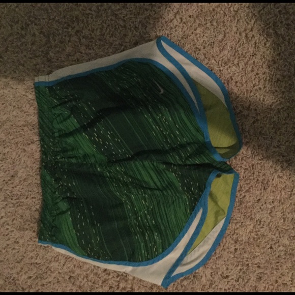green pattern and blue nike shorts