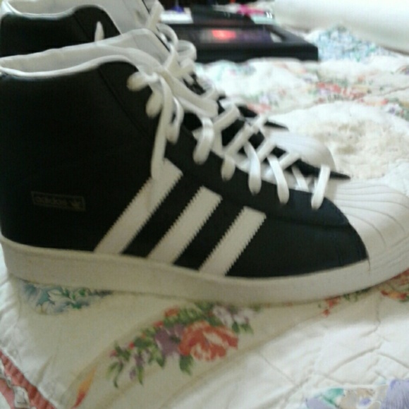 Black and white high-top Adidas