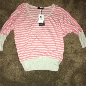 Pink and white striped quarter length shirt.