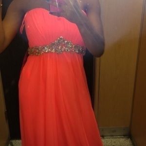 A long pink formal dress