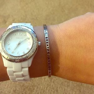 Mantra band! Reads "Smile. Breathe. And Go Slowly"