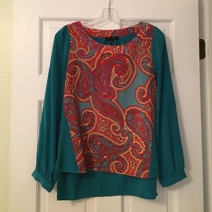Turquoise and multi-colored blouse.