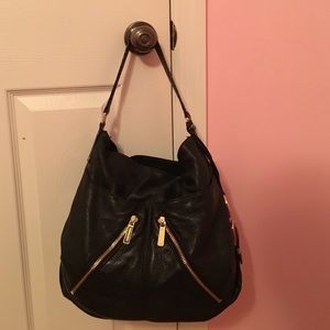 Michael kors black bag with gold zippers
