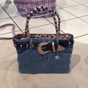Very cute "denim" purse with cheetah inside.