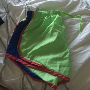 Green running shorts
