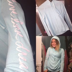 A turquoise light sweatshirt