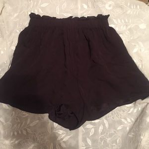 Tangerine fabric shorts.