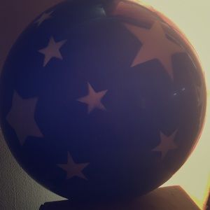 A blue ball with white stars