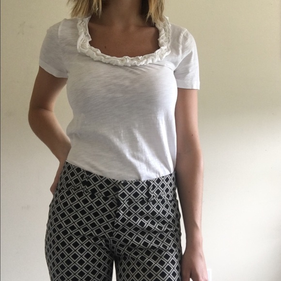 White j crew shirt with ruffle neckline