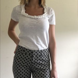 White j crew shirt with ruffle neckline