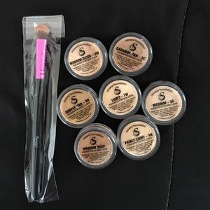 Different Color Foundations and a makeup brush
