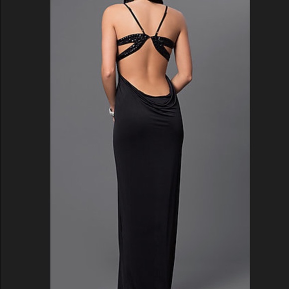Formal dress, open back, adjustable straps.