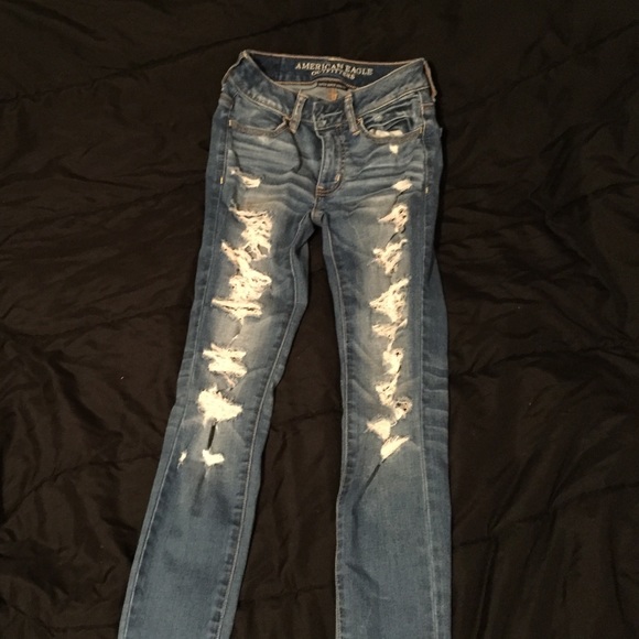 Medium light wash distressed American eagle jeans