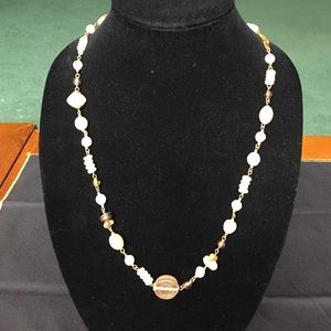 Beautiful neutral colored necklace.