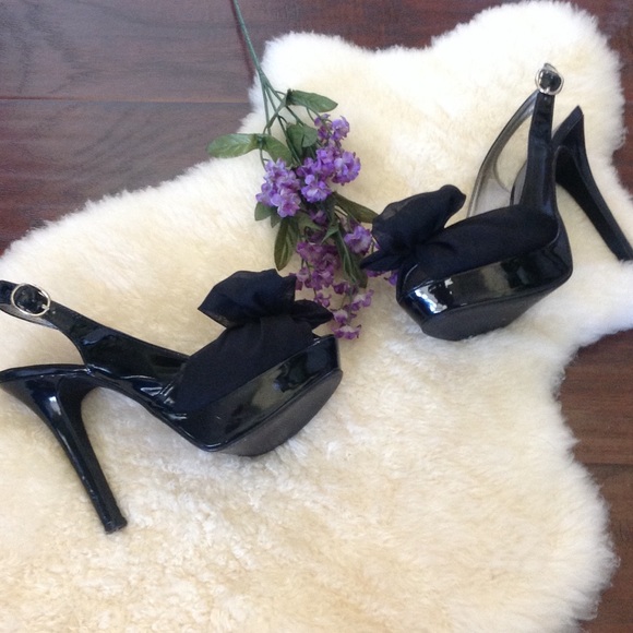 Black patent leather sling-back heels