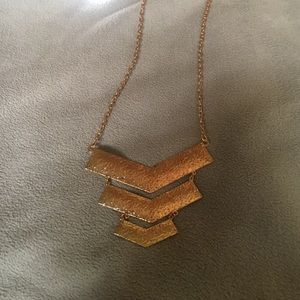 Long gold necklace