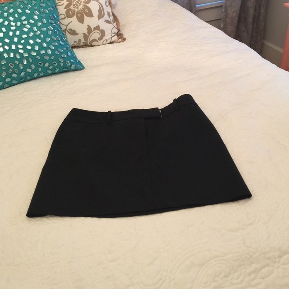 Black mini skirt, with pockets. Belt loops also