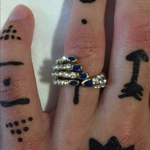 Beautiful Gold Hand Shaped Ring with Blue Stones