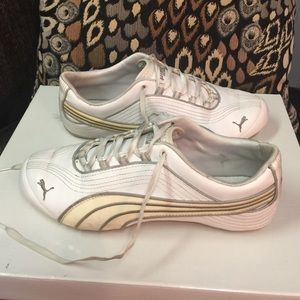 7.5 White Puma tennis shoes.