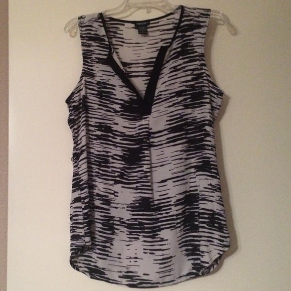 Black and white sleeveless blouse with belt