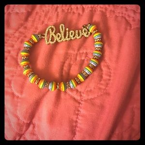 Diamond encrusted believe bracelet.