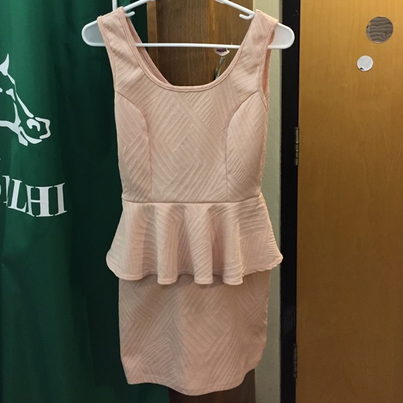 Cute peach peplum dress from Necessary Clothing.